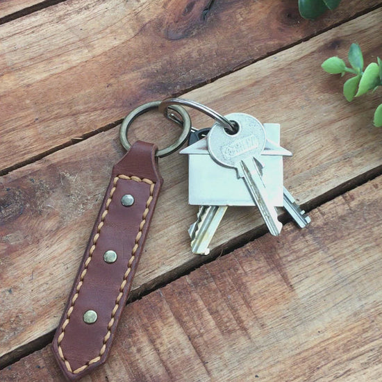 Video Showing a Handmade Brown Leather Studded Keychain with Hazel Stitching