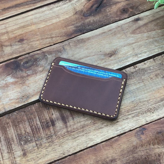 video showing the Handmade Minimalist Brown Leather Card Wallet with Hazel Stitching
