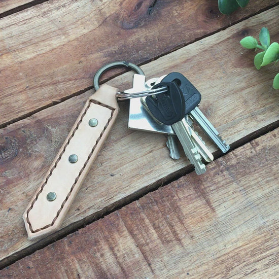 Video Showing a Handmade Natural Undyed Leather Studded Keychain with Brown  Stitching