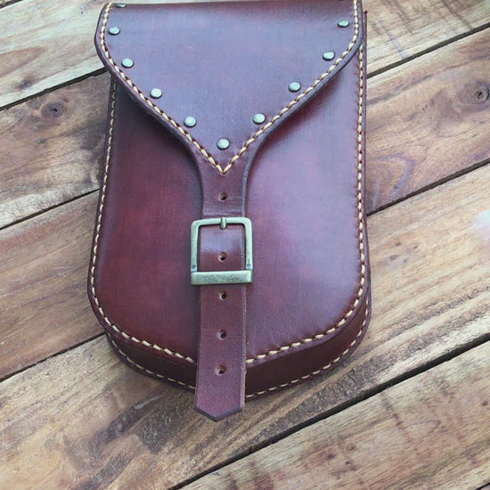 Video Showing a Large Handmade Mahogany Color Leather Belt Pouch with Buckle closing and Studs 