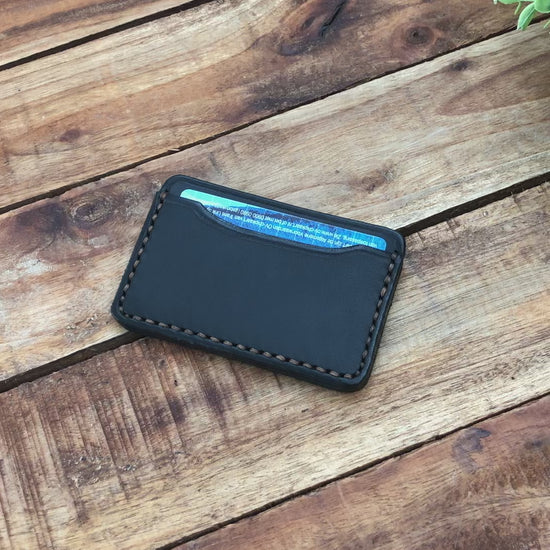 Video showing a Handmade Minimalist Black Leather Card Wallet