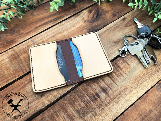 Handmade Two-tone Bifold Leather Card Wallet in Brown and Natural color with brown stitching next to a bunch of keys