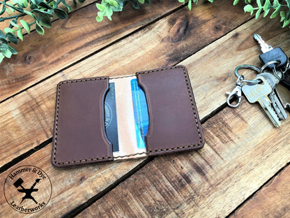 Handmade Two-tone Bifold Leather Card Wallet in Natural and brown color with brown stitching next to a bunch of keys