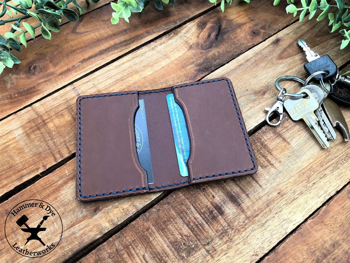 Handmade Brown Bifold Leather Card Wallet on a desk next to some keys