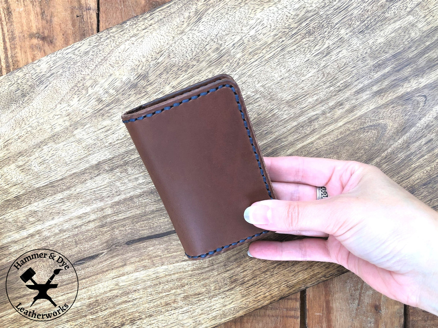 Handmade Brown Bifold Leather Card Wallet held in a hand