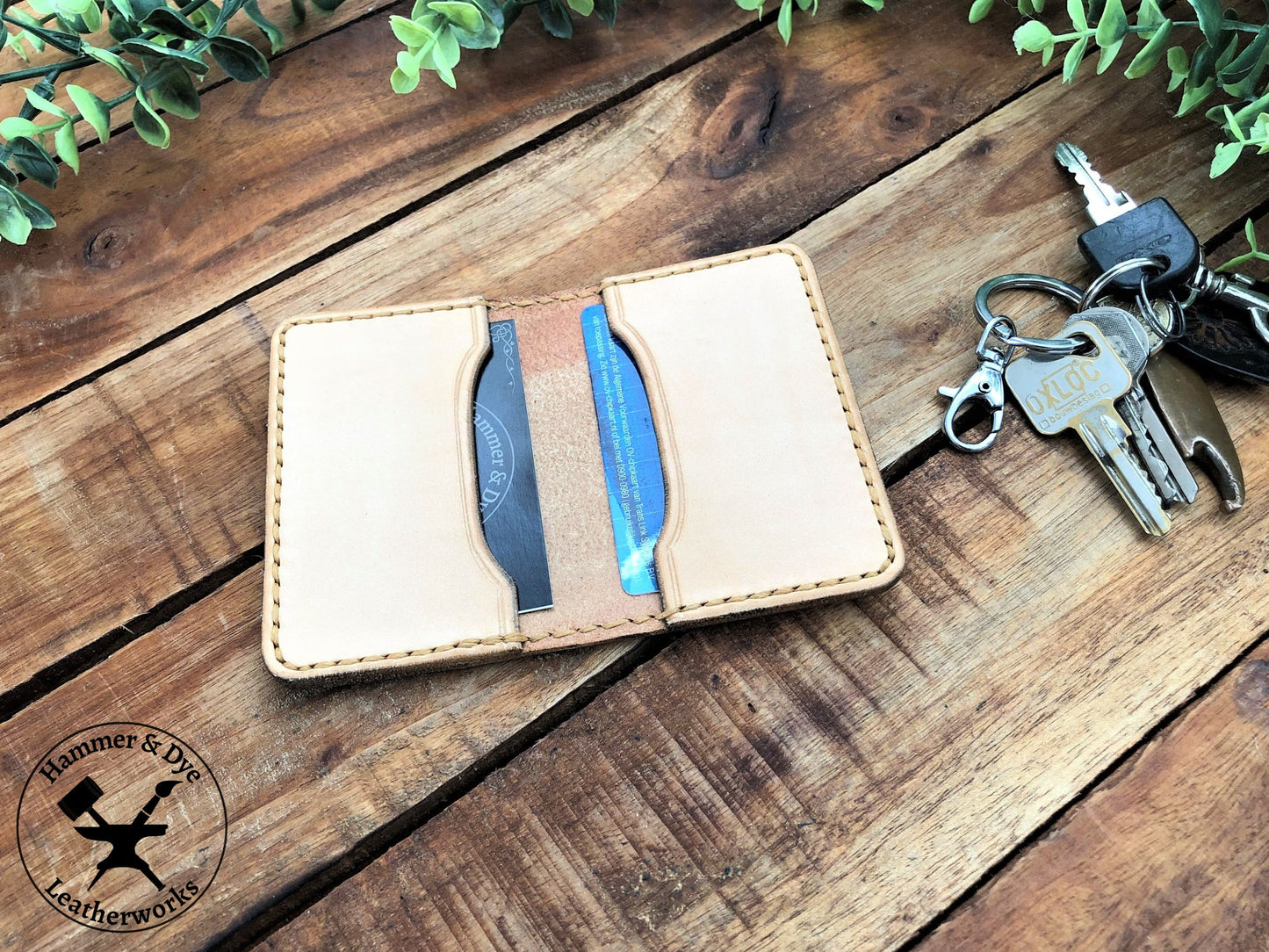 Handmade Natural Bifold Leather Card Wallet on a desk next to some keys