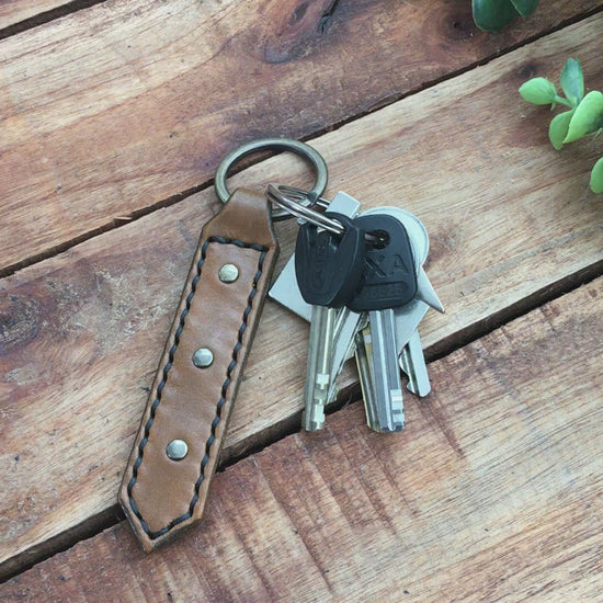 Video Showing a Handmade Antique Brown Leather Studded Keychain with Black Stitching