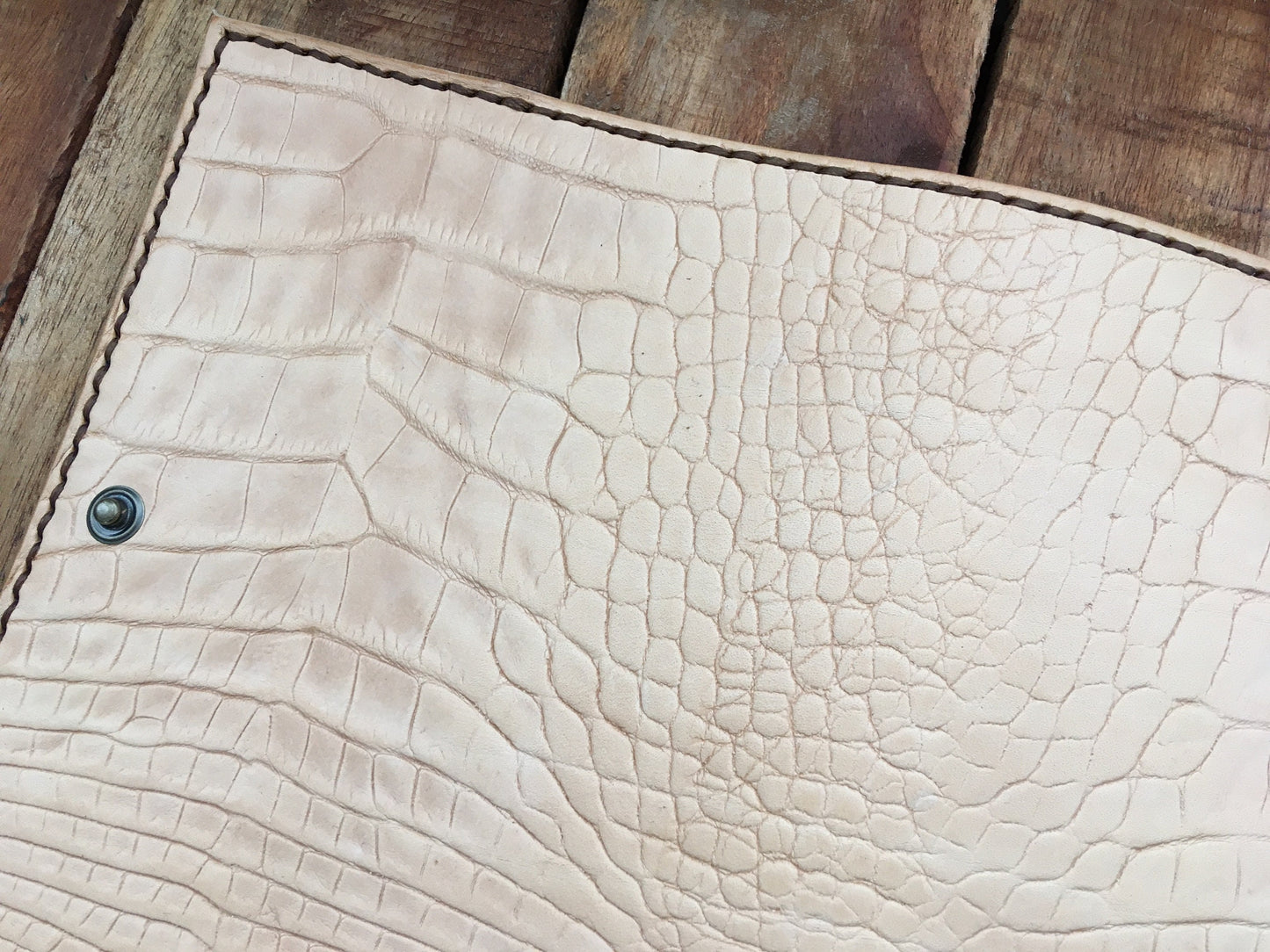 Close up of a Handmade undyed Leather Alligator Embossed Book Cover 