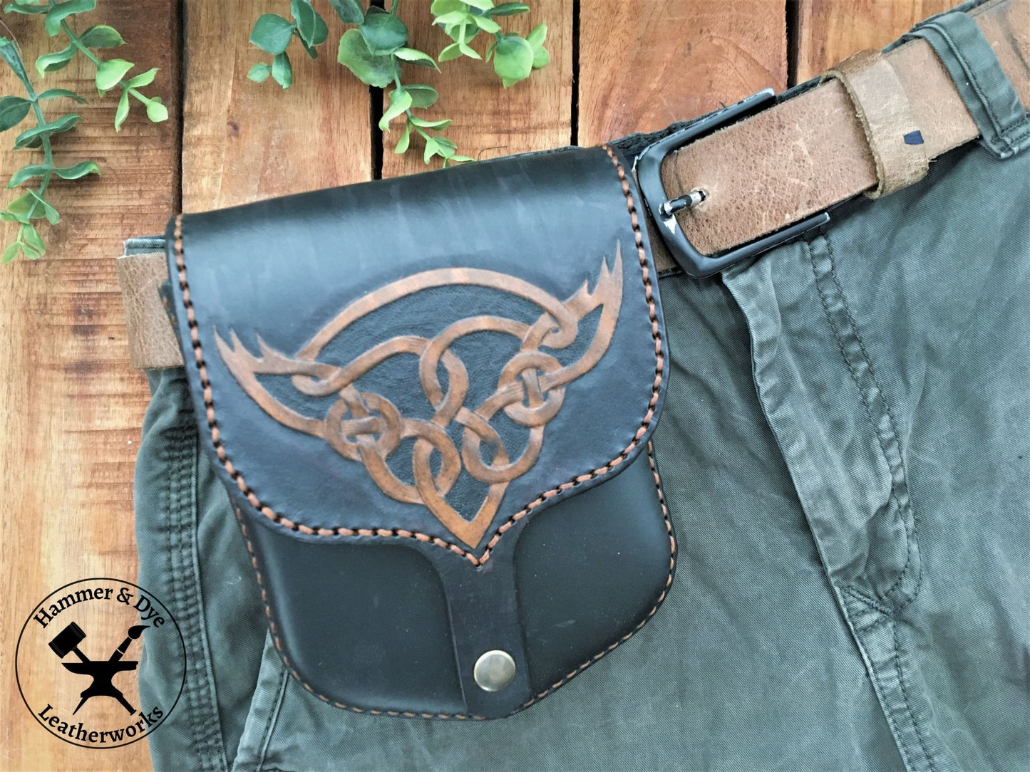 Handmade Black Leather Belt Pouch with Hand Carved Celtic Knotwork Design on a trouser belt