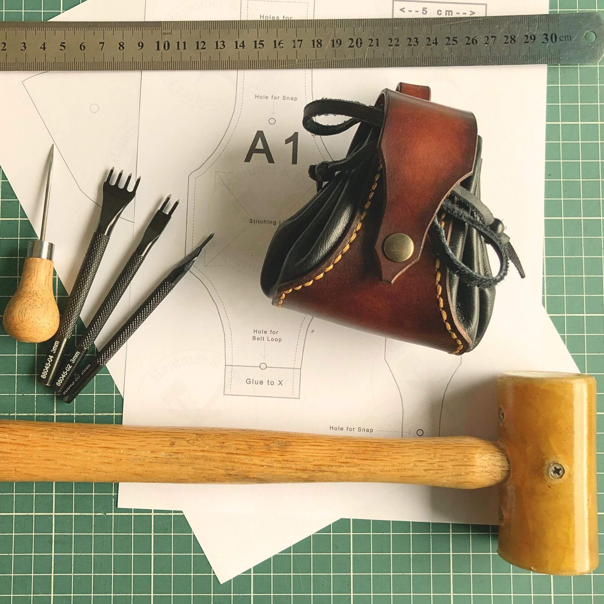 drawstring dice pouch pattern, leathercraft tools and finished product