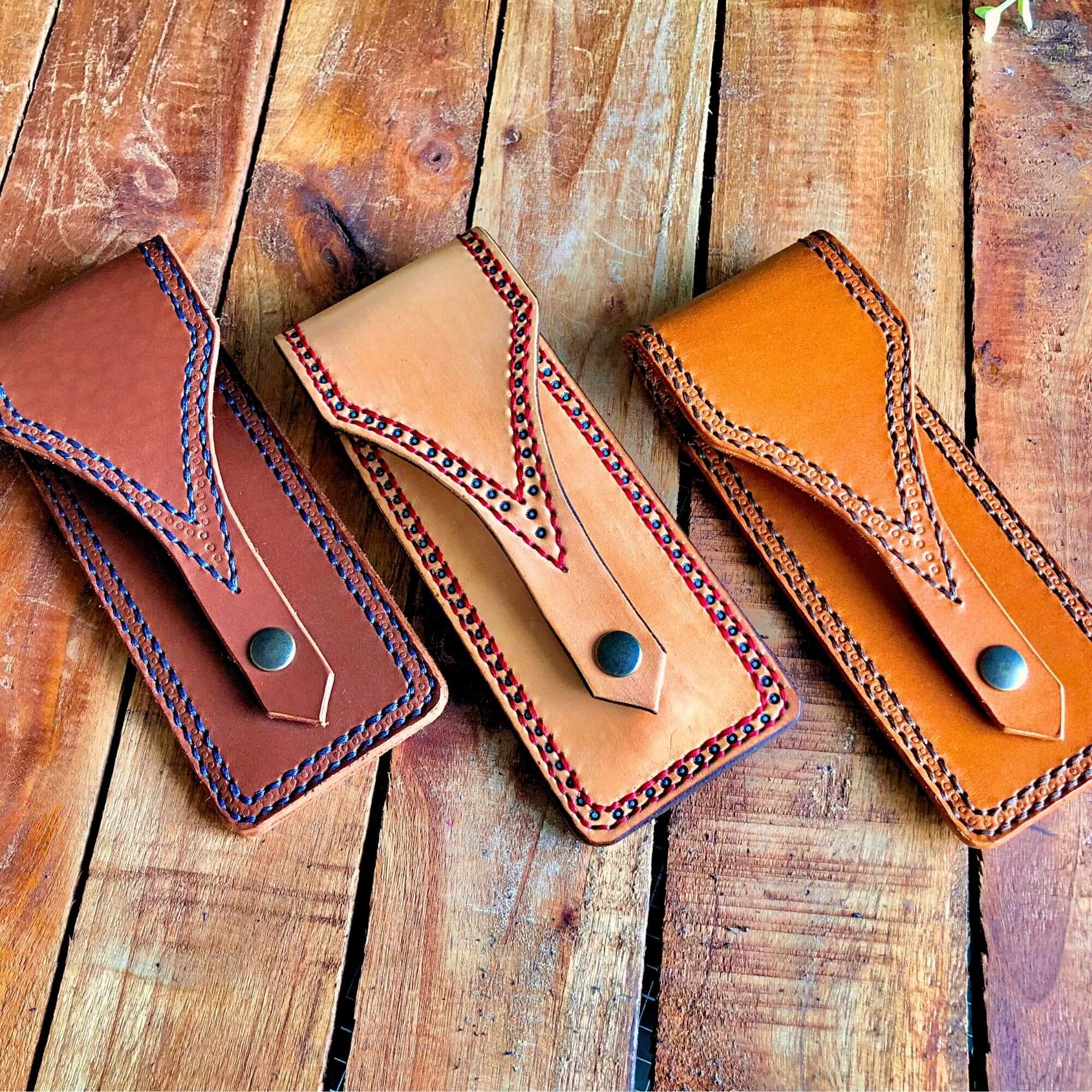 3 handmade leather pen pouches with decorative details