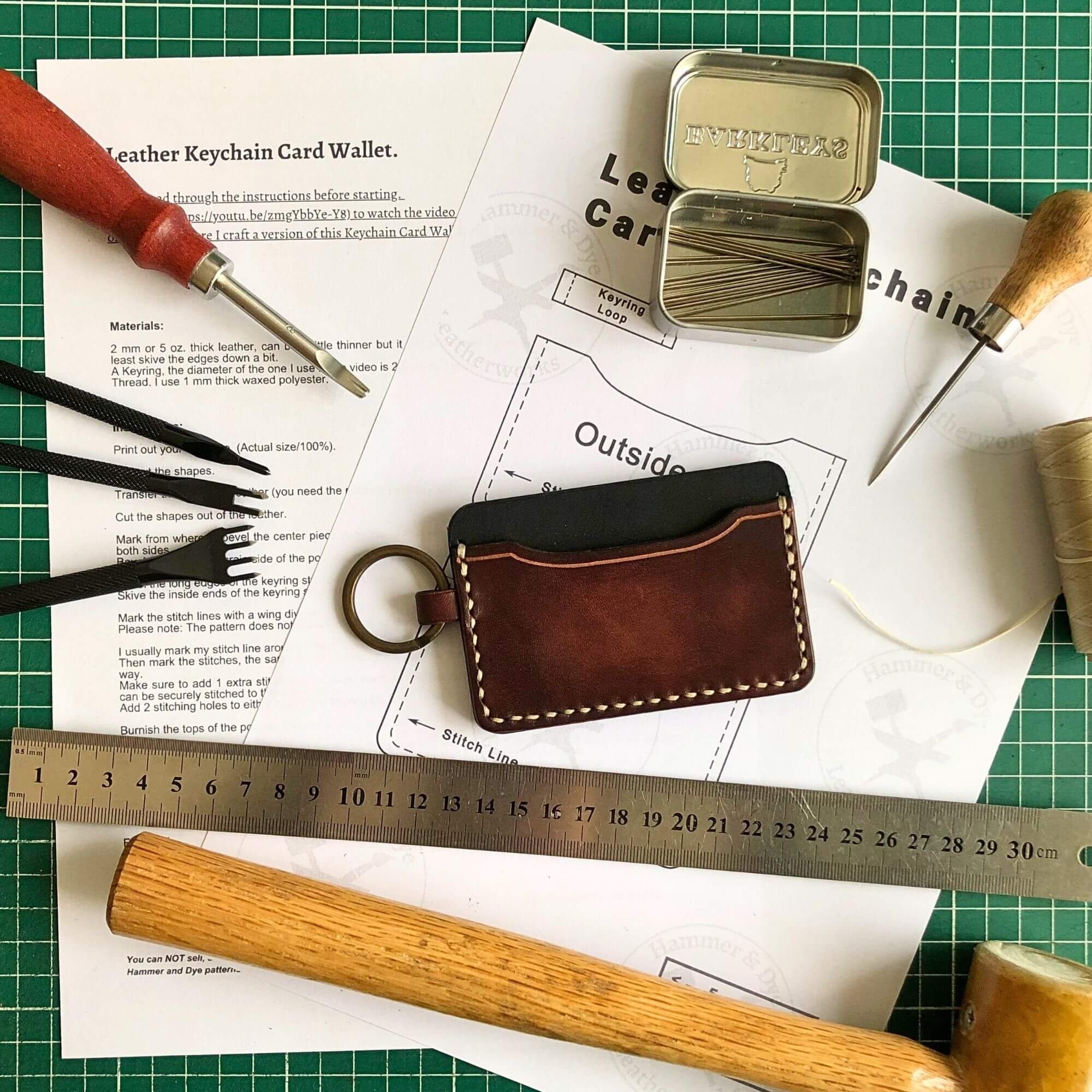 Small Wallet Bundle 10 leathercraft pattern for a keychain card wallet surrounded by leathercraft tools and the finished product