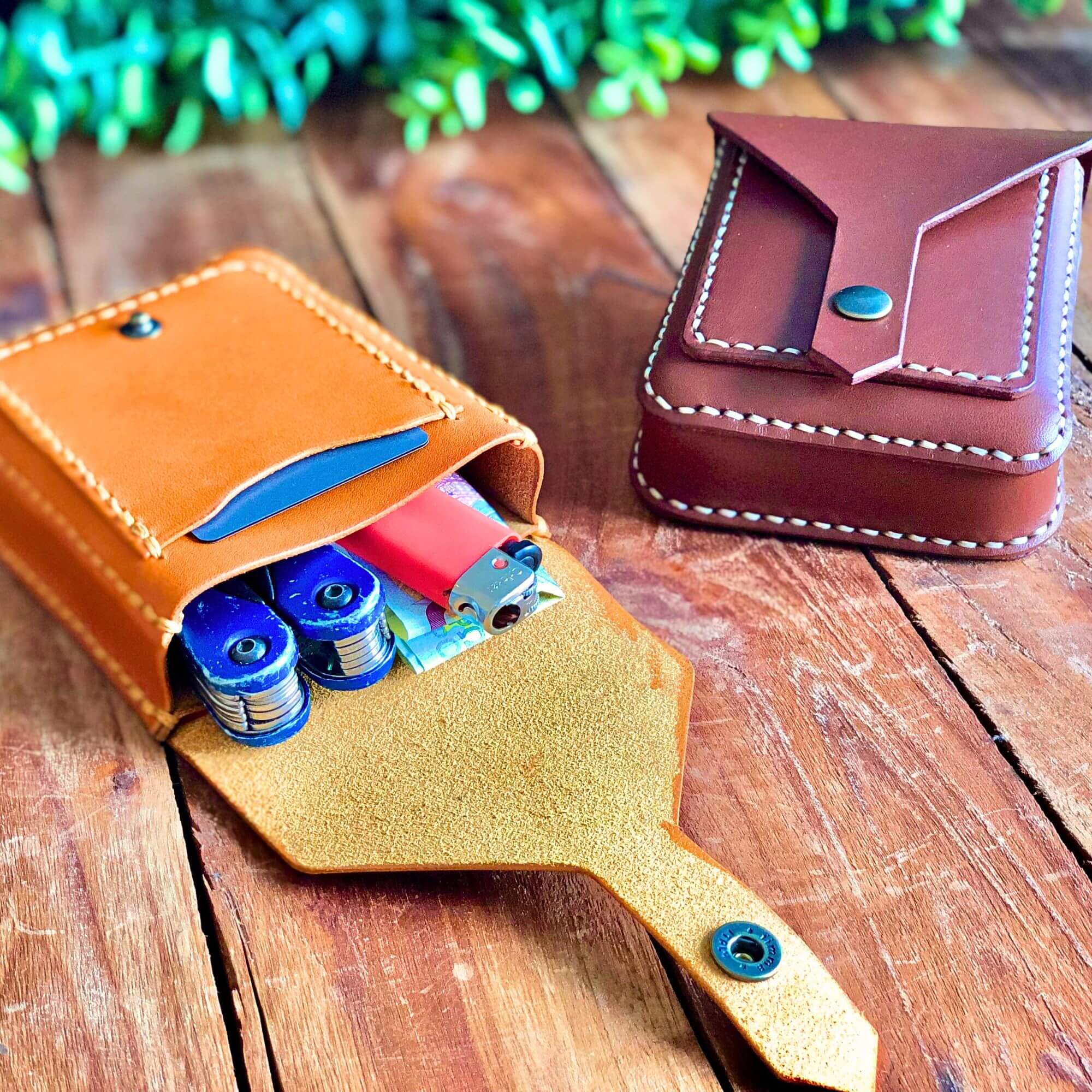 a brown and tan belt bag filled with personal belongings