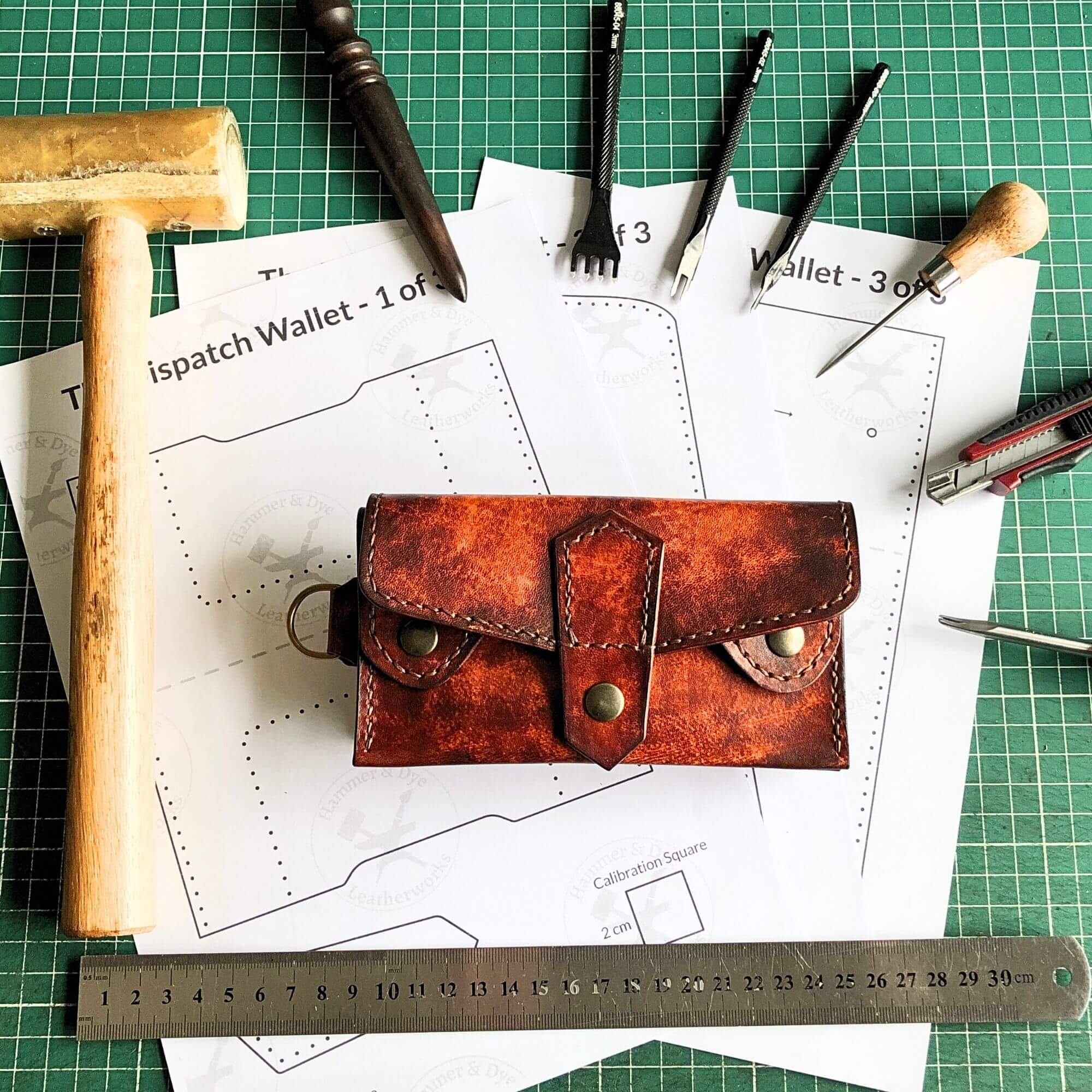 leathercraft pattern for a full carry wallet, finished example in hand-stitched tan and mahogany veg tan