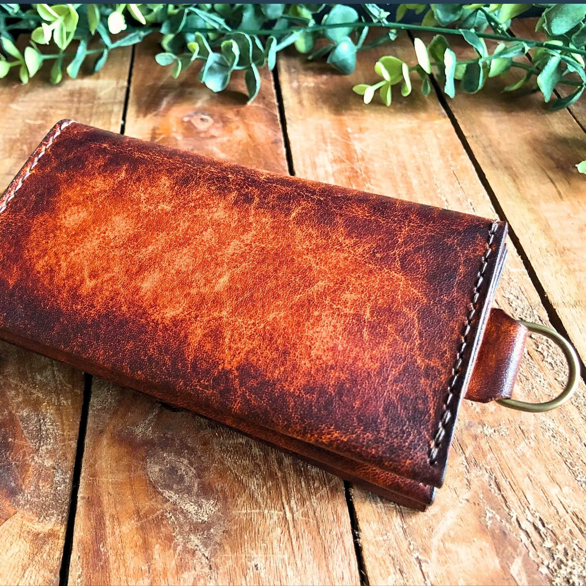 Dispatch wallet showing d-ring chain attachment, made from hand-dyed vegetable tanned leather