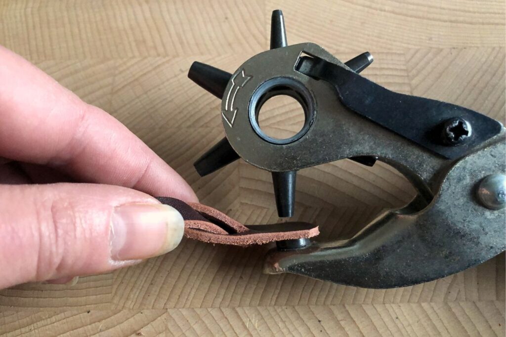 How to Set Snaps 7 Punching a hole in leather with a rotary punch