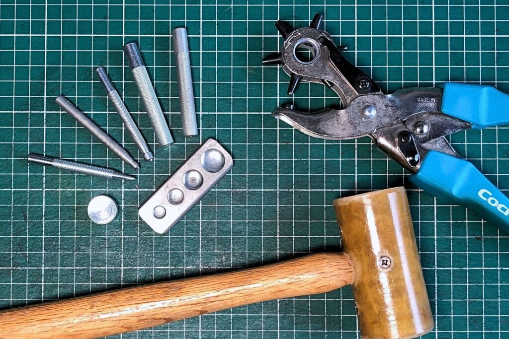 How to Set Snaps 4 Tools required for installing snaps in leather by hand: several setter tools, an anvil, a hole punch and a mallet